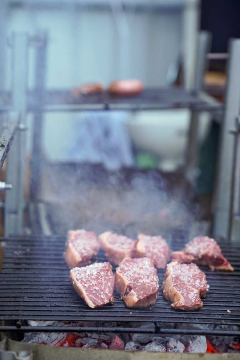 Steak cooking over open flame