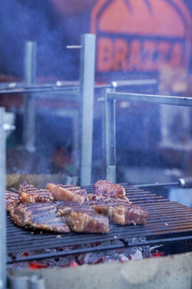 Steak cooking over open flame